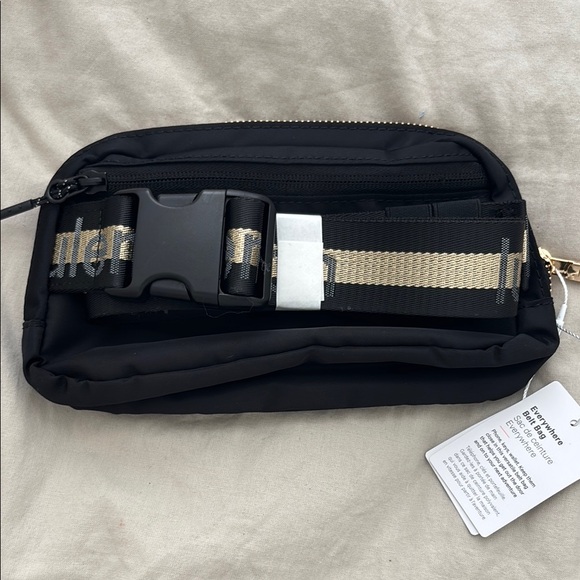 Lululemon Athletica Black and Gold Belt Bag with Minimalist Design size 1L - Picture 1 of 3